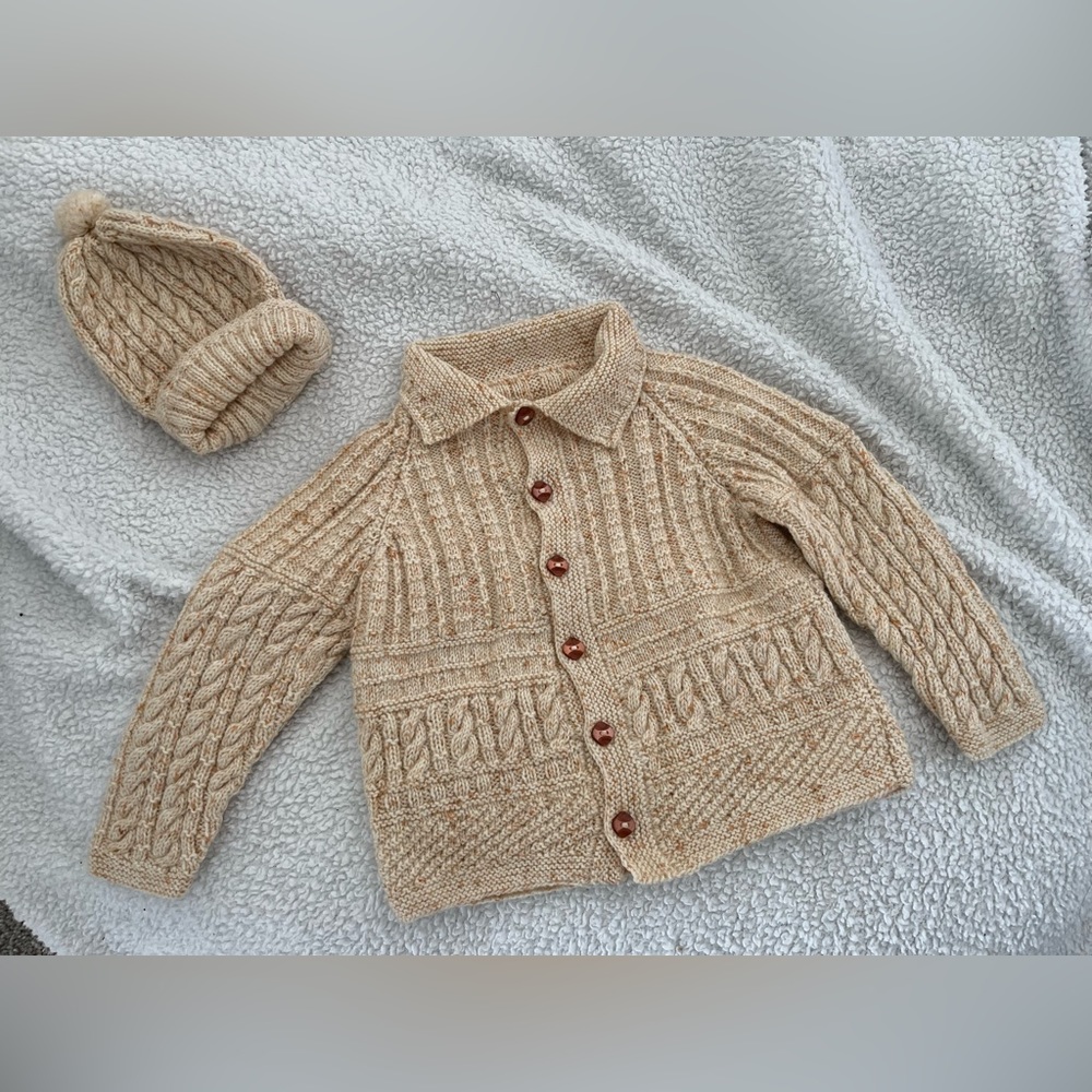 Adorable baby sweater and bonnet set